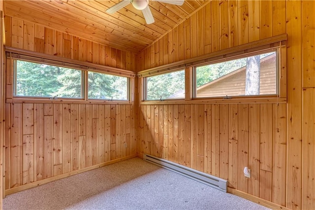 interior space with wooden ceiling, wooden walls, a baseboard heating unit, carpet floors, and vaulted ceiling