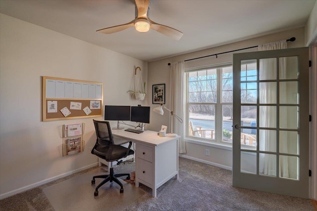 office featuring ceiling fan, baseboards, and carpet