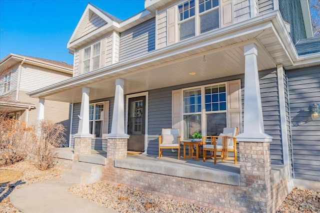 doorway to property with covered porch