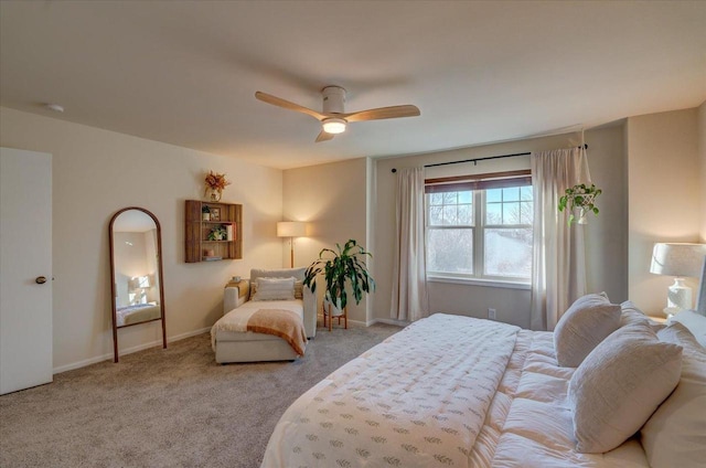 carpeted bedroom with a ceiling fan and baseboards