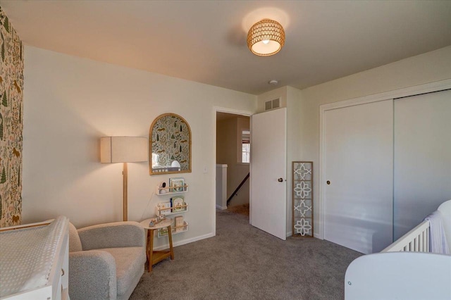 bedroom with a closet, carpet flooring, and visible vents