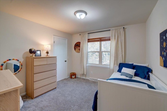 carpeted bedroom featuring visible vents