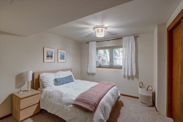 bedroom featuring baseboards and carpet floors