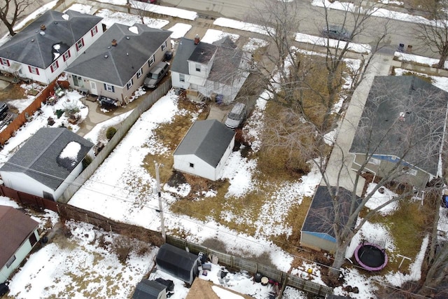 snowy aerial view with a residential view