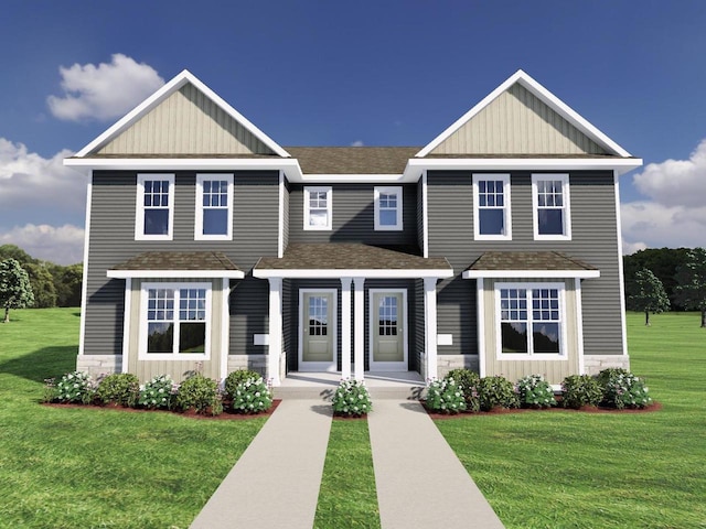 view of front of home featuring board and batten siding, a front yard, stone siding, and roof with shingles