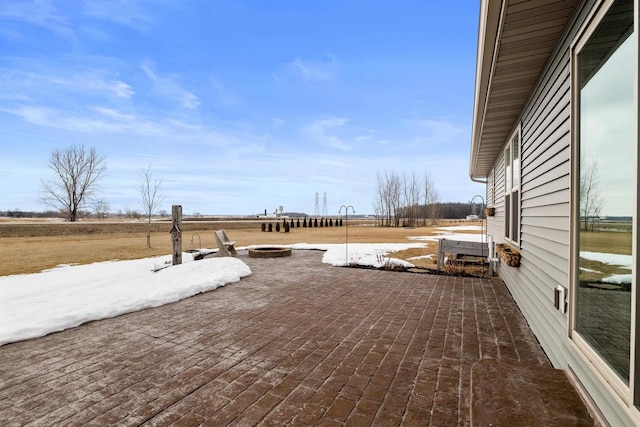 wooden terrace featuring an outdoor fire pit and a patio area