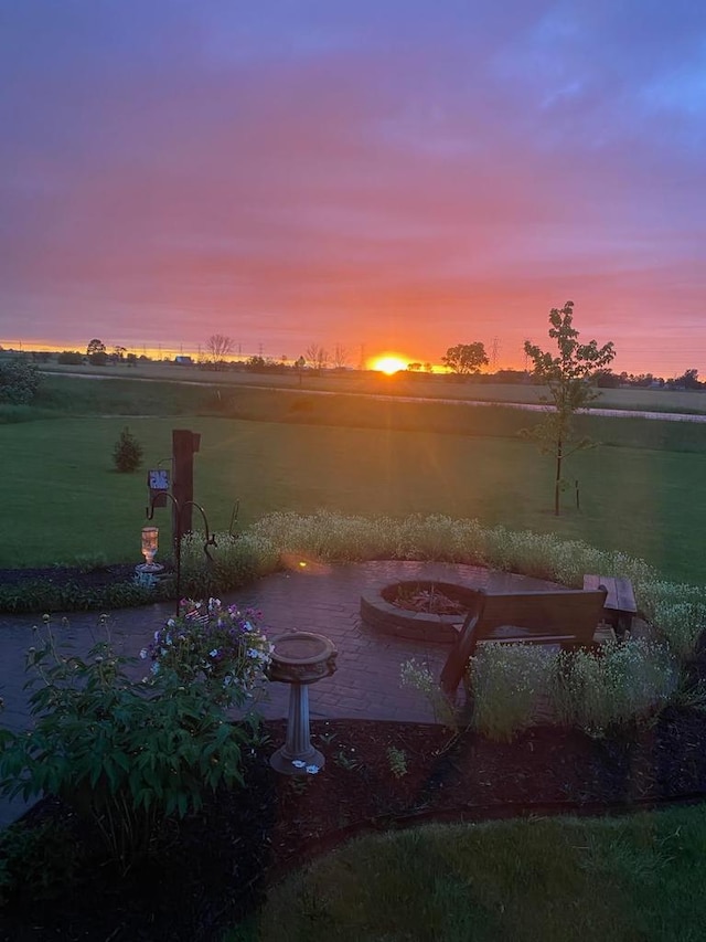 view of yard with an outdoor fire pit