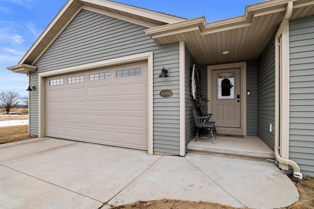 garage with concrete driveway