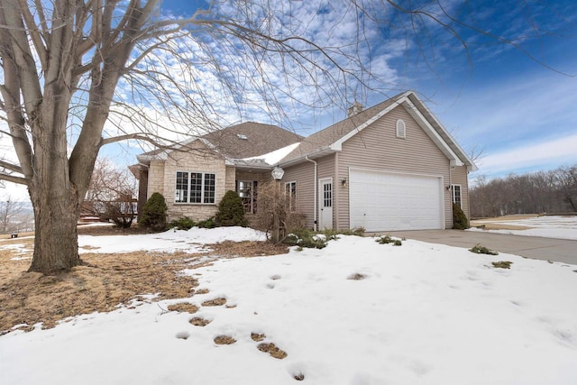 view of front of house with stone siding and an attached garage