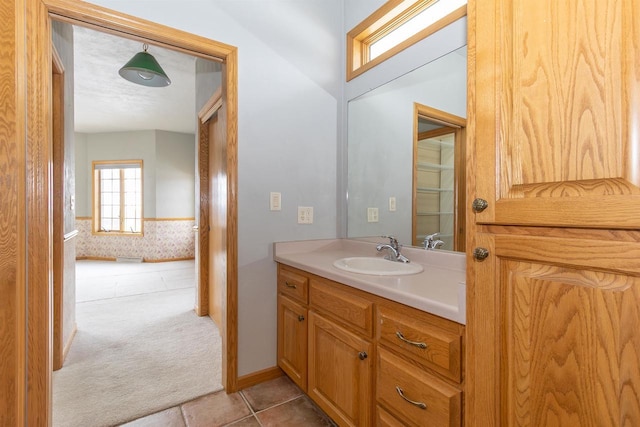 bathroom with tile patterned flooring and vanity