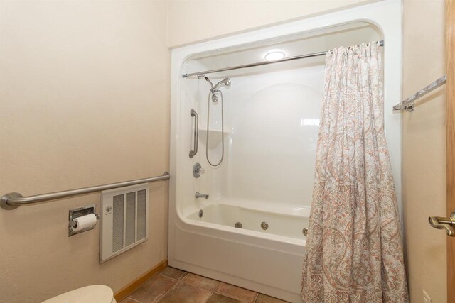 full bath featuring toilet, shower / tub combo, visible vents, and tile patterned floors