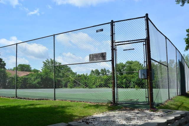 view of sport court featuring a gate and fence