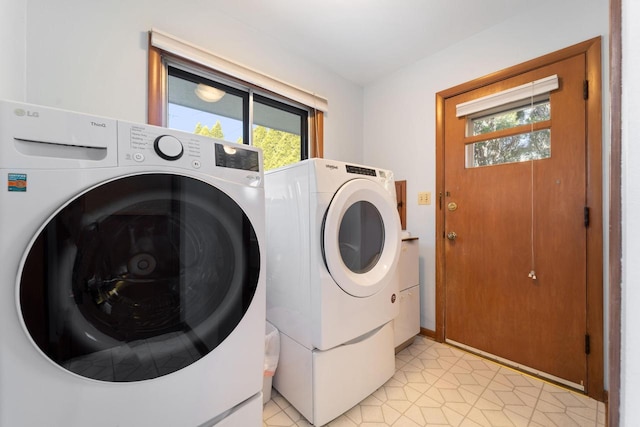 washroom featuring laundry area and separate washer and dryer