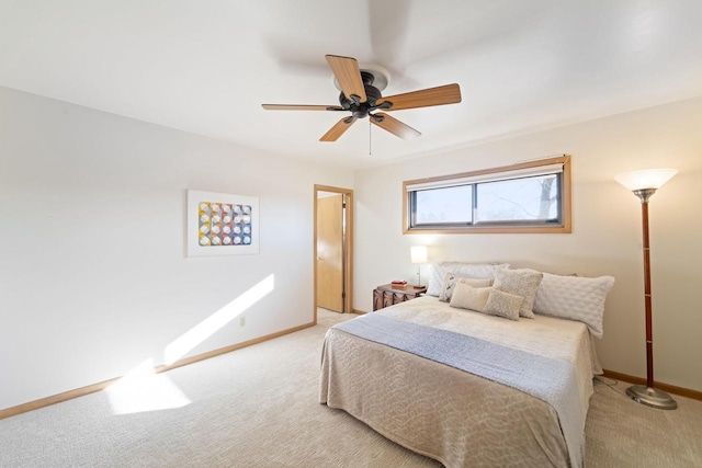 bedroom with ceiling fan, baseboards, and light colored carpet