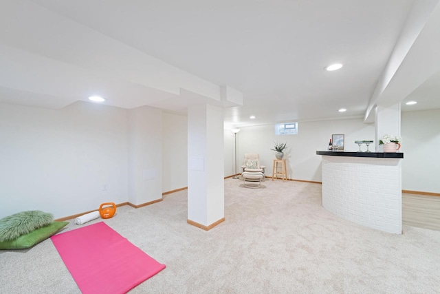 interior space with a dry bar, carpet, baseboards, and recessed lighting