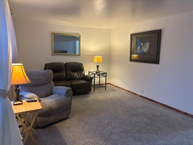 carpeted living room featuring baseboards