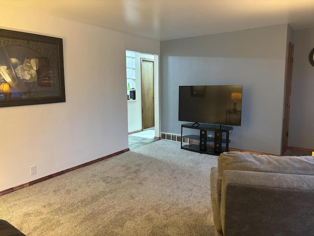 living room featuring carpet floors and baseboards