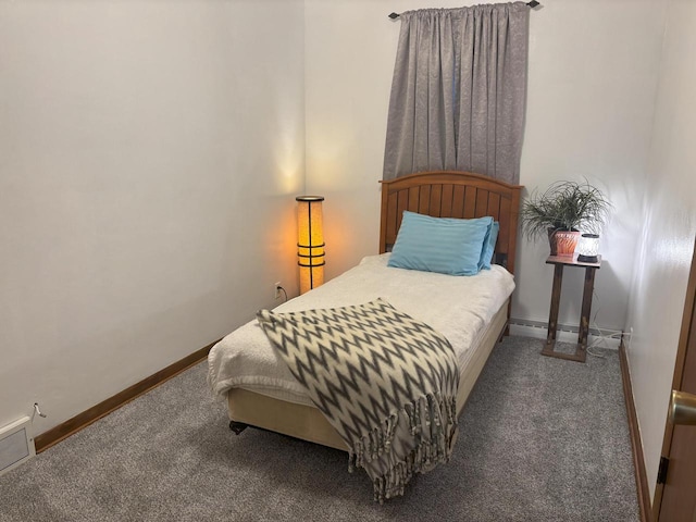 carpeted bedroom with visible vents and baseboards