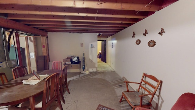 dining area featuring concrete flooring