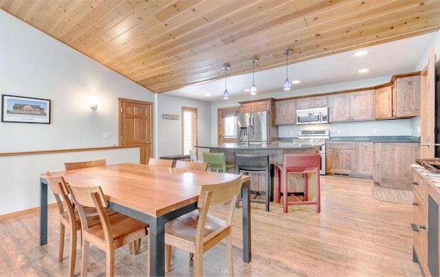 N8111 Castaway Dr, New Lisbon, WI 53950 - dining room with wood ceiling, light wood-style flooring, baseboards, and vaulted ceiling