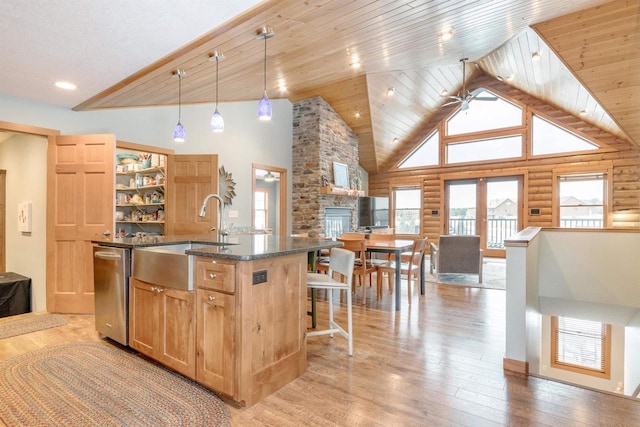 N8111 Castaway Dr, New Lisbon, WI 53950 - kitchen featuring open floor plan, high vaulted ceiling, light wood finished floors, and a sink