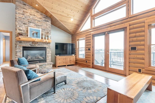 N8111 Castaway Dr, New Lisbon, WI 53950 - living area featuring french doors, rustic walls, wood finished floors, high vaulted ceiling, and wooden ceiling