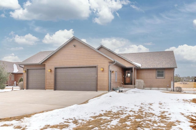 N8111 Castaway Dr, New Lisbon, WI 53950 - view of front of home with driveway and an attached garage