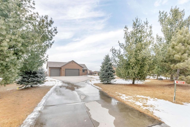 N8111 Castaway Dr, New Lisbon, WI 53950 - view of front of house with a detached garage and an outdoor structure