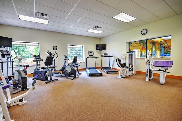 N8111 Castaway Dr, New Lisbon, WI 53950 - gym with baseboards, a healthy amount of sunlight, visible vents, and a drop ceiling