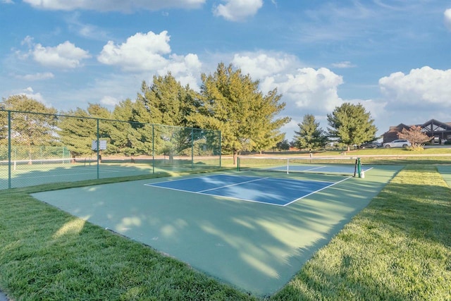 N8111 Castaway Dr, New Lisbon, WI 53950 - view of tennis court with a yard and fence