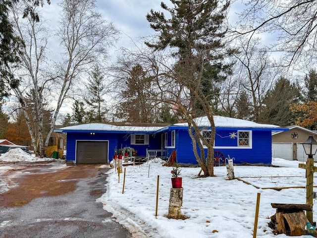 ranch-style house featuring a garage