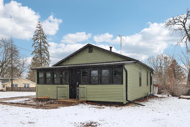 exterior space featuring a sunroom