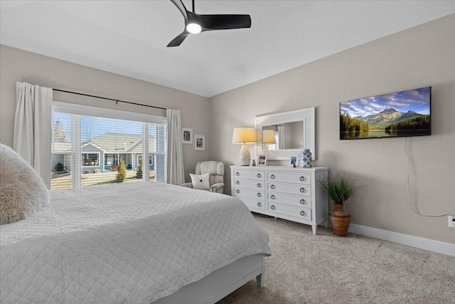 carpeted bedroom with a ceiling fan and baseboards