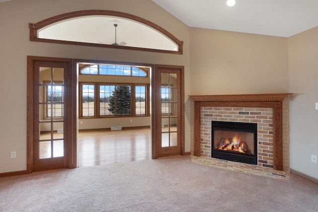 unfurnished living room with recessed lighting, carpet, a fireplace, and baseboards