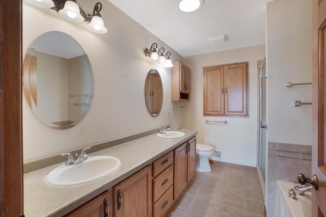 full bath with a shower with door, double vanity, toilet, a sink, and tile patterned flooring