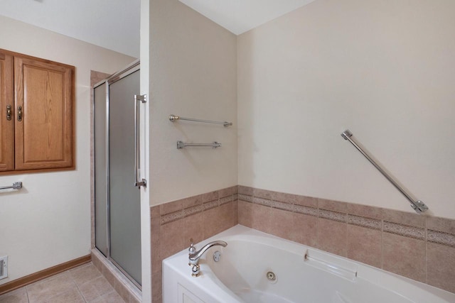 bathroom with a whirlpool tub, a stall shower, tile patterned flooring, and baseboards