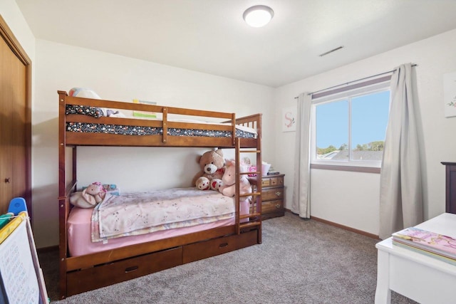 bedroom with carpet flooring, visible vents, and baseboards