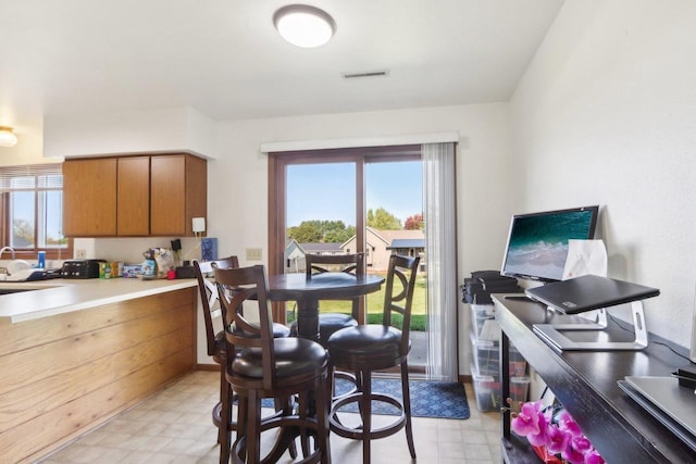 dining room with light floors and visible vents