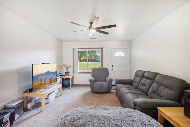 carpeted living room featuring a ceiling fan