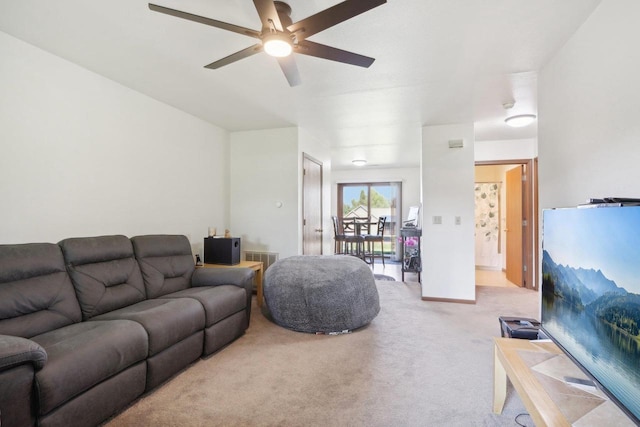 living room with ceiling fan and light colored carpet