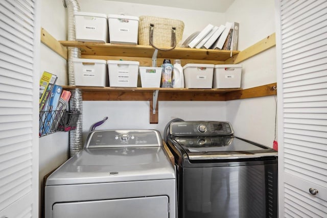 clothes washing area featuring laundry area and independent washer and dryer