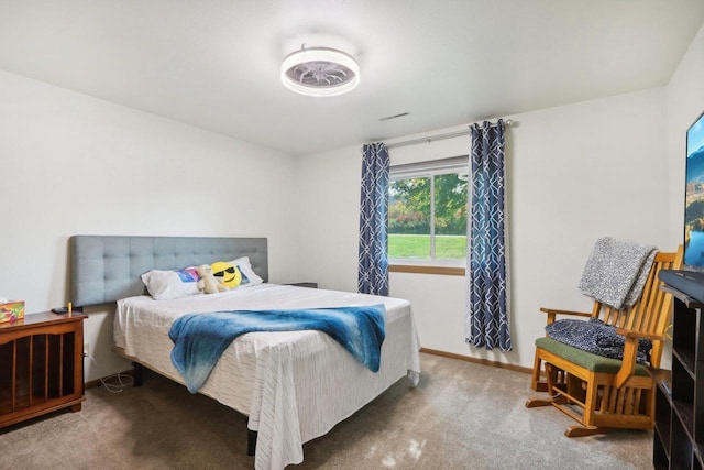 bedroom featuring carpet floors and baseboards