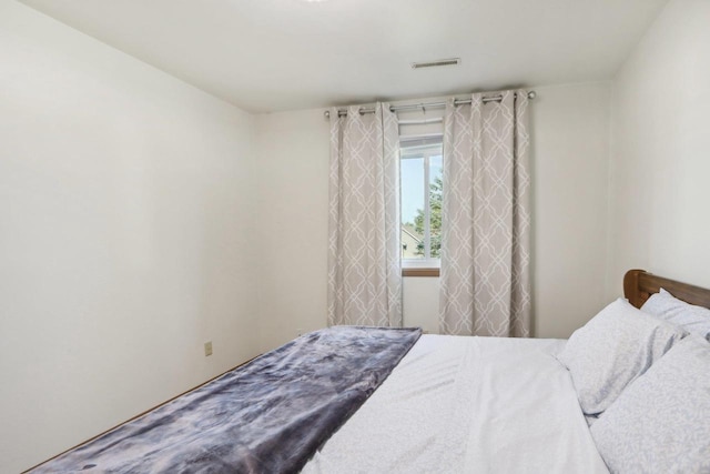 bedroom with visible vents