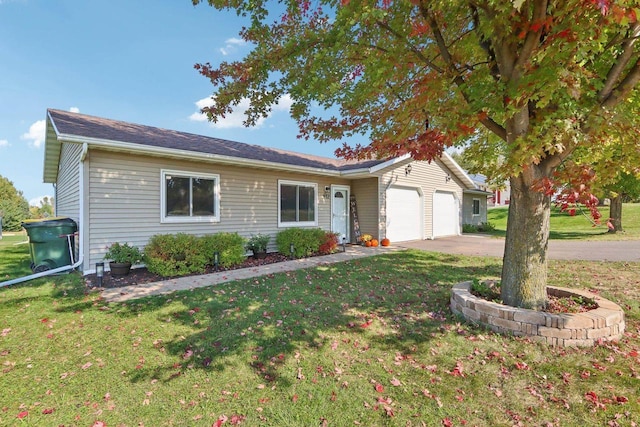 single story home featuring a garage, concrete driveway, and a front yard