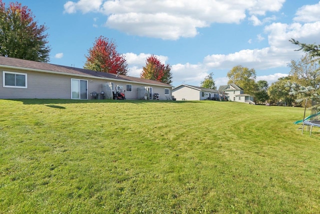 view of yard featuring a trampoline