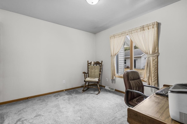 carpeted office with visible vents and baseboards