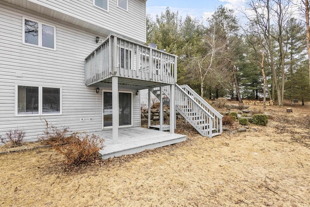 back of house featuring a deck, a patio, and stairway