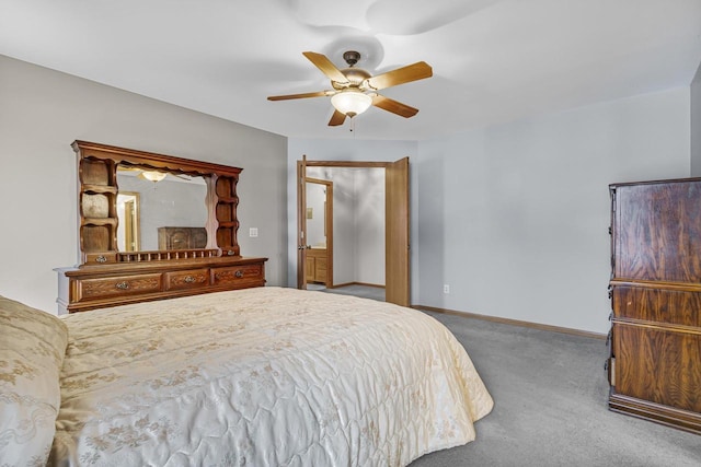 carpeted bedroom with ceiling fan and baseboards