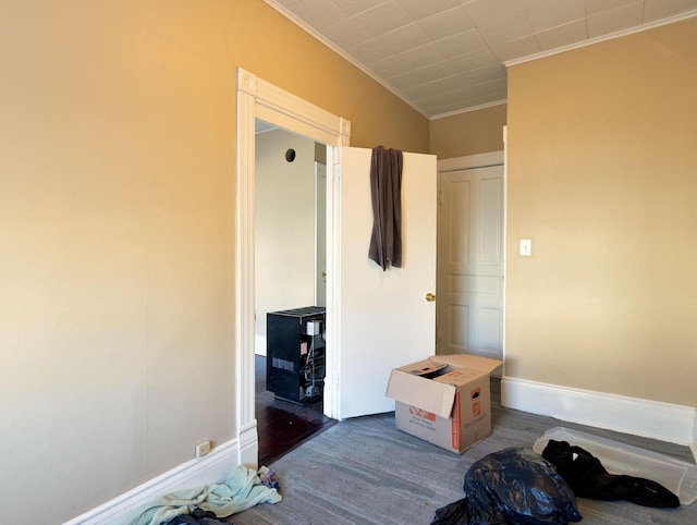 mudroom featuring ornamental molding and baseboards