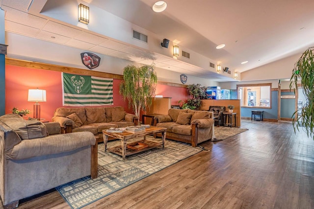 interior space featuring vaulted ceiling, wood finished floors, visible vents, and recessed lighting